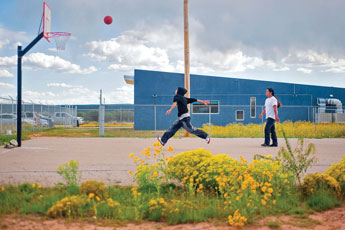 Aaron Galvan and Isaac Tom, right, play a game of basketball during an after-school program at the Thoreau Community Center Wednesday. © 2011 Gallup Independent / Cable Hoover 